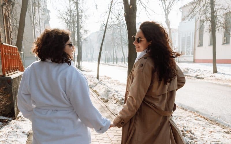 mother and daughter holding hands