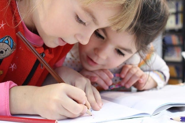 two kids drawing