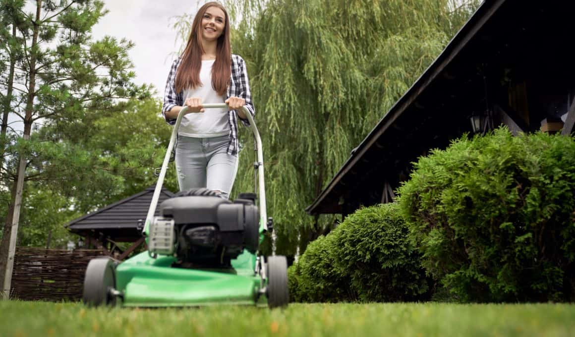 woman mowing the lawn