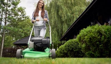 woman mowing the lawn