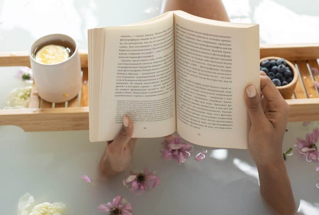 woman reading in a bathtub