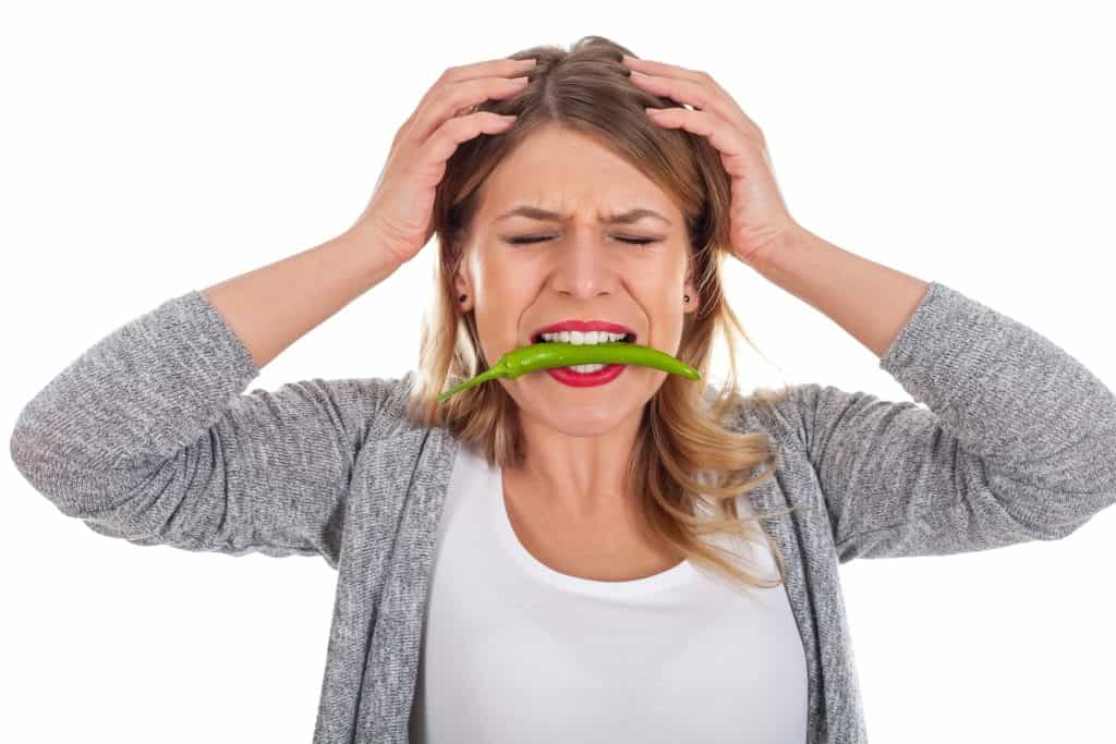 woman with chili on her mouth