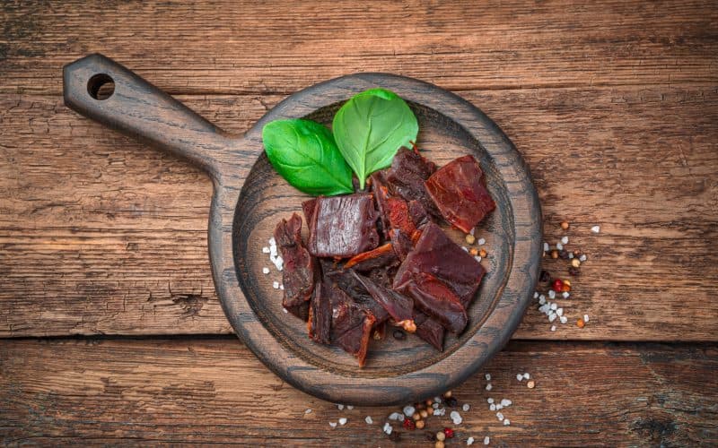 beef jerky on wooden pan
