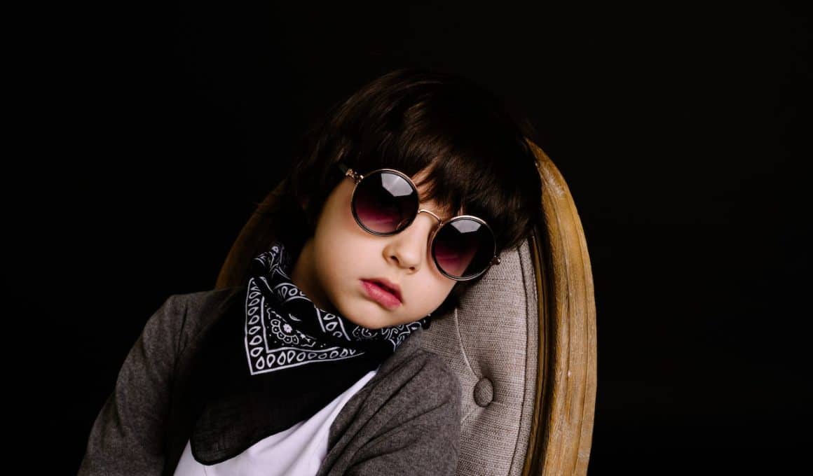 boy wearing sunglasses and bandana