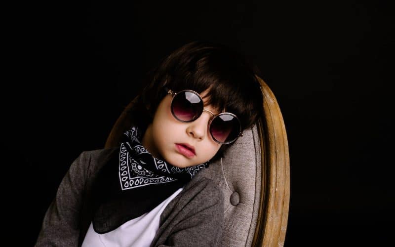 boy wearing sunglasses and bandana