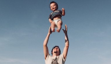 dad throwing baby up in the air