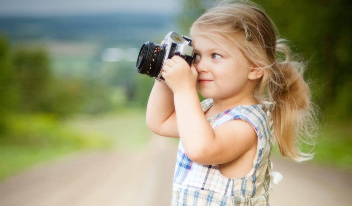 girl holding a camera