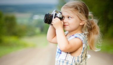 girl holding a camera