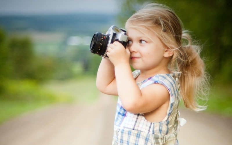 girl holding a camera