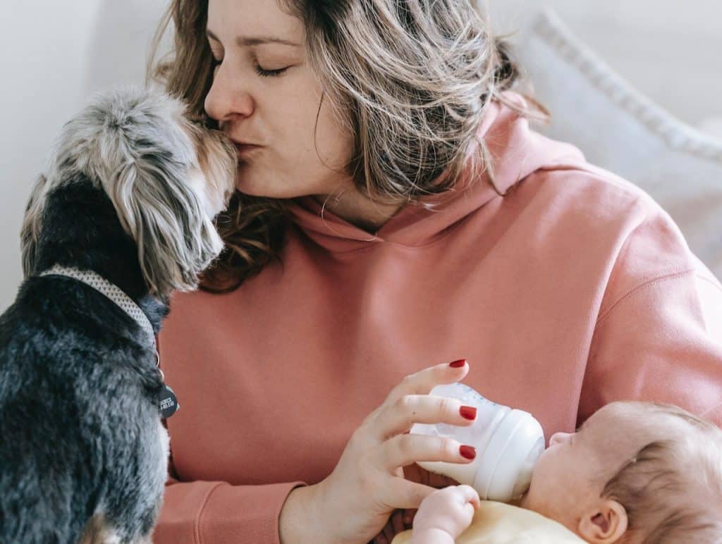 mom kissing dog