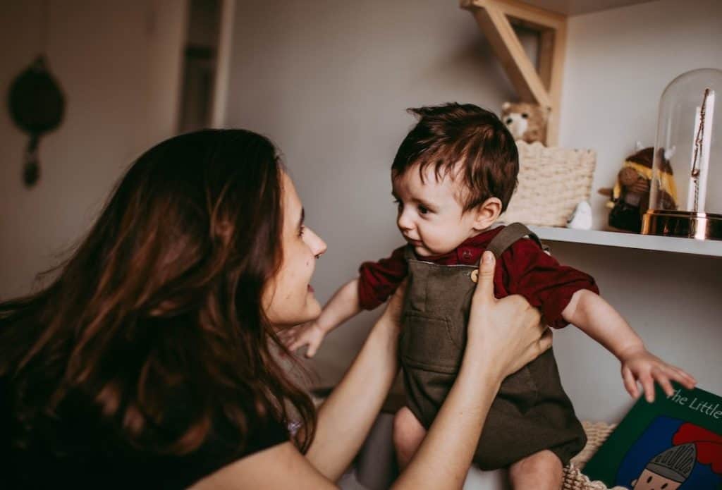 mom smiling at her toddler