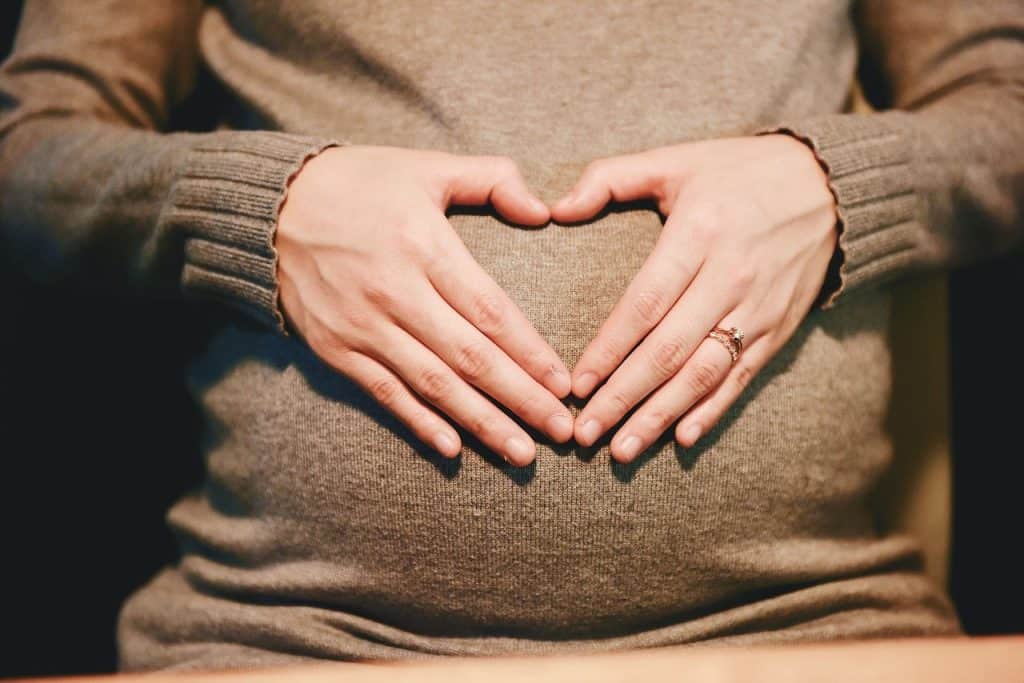 pregnant woman wearing sweater