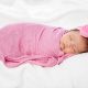 baby on a pink swaddle