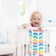 baby smiling on a crib
