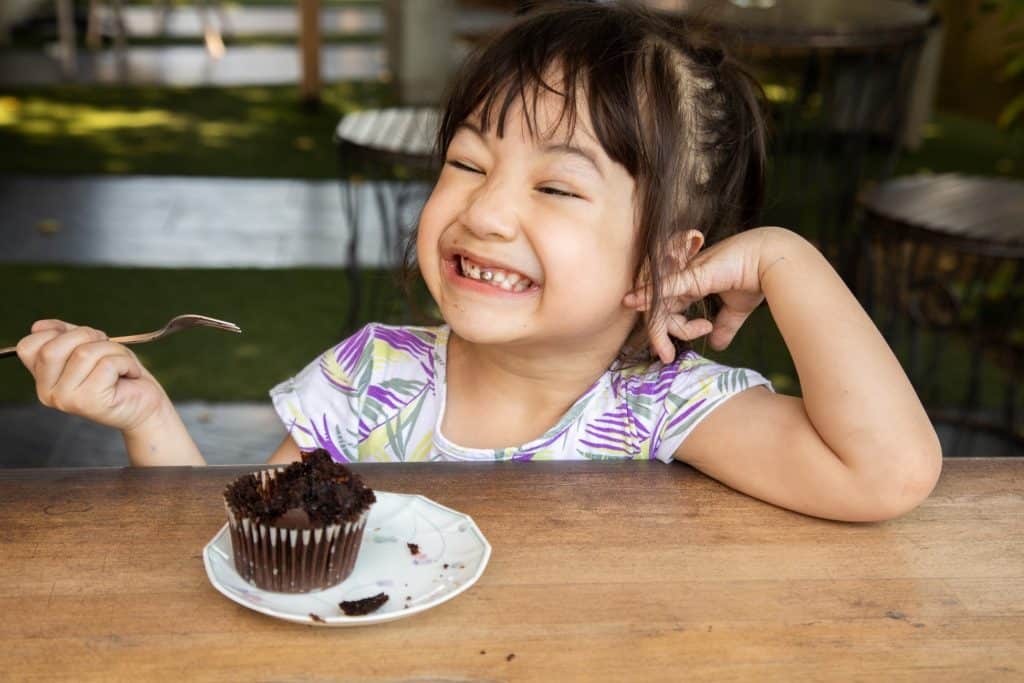 girl eating cupcake
