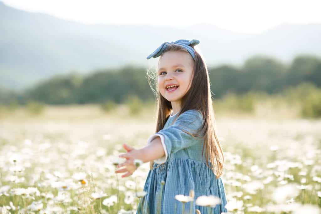 girl on a field of flowers