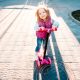 little girl riding on a scooter