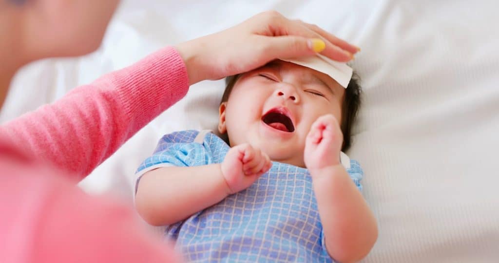 mom soothing crying baby