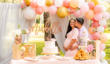 man kissing a woman during a baby shower