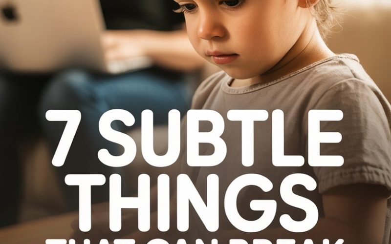 Young boy feeling worried or thoughtful about confidence issues, with a supportive adult nearby.