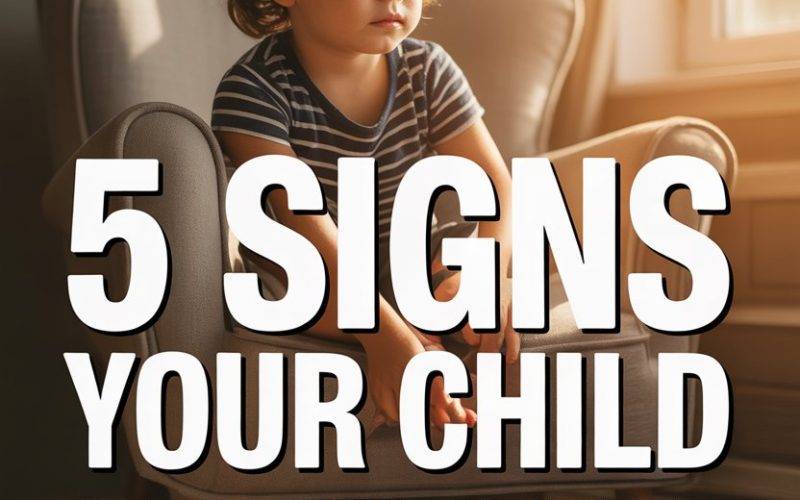 Child sitting thoughtfully on a beige armchair, showing signs of bottling up emotions.