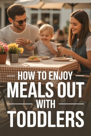 Happy family enjoying an outdoor meal with toddlers at café patio.