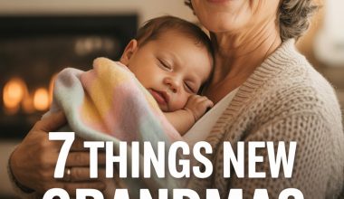 Happy grandma holding sleeping baby with rainbow blanket in cozy home environment.
