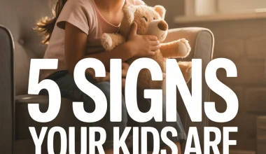 Young girl holding teddy bear, feeling sad or contemplative about family separation signs.