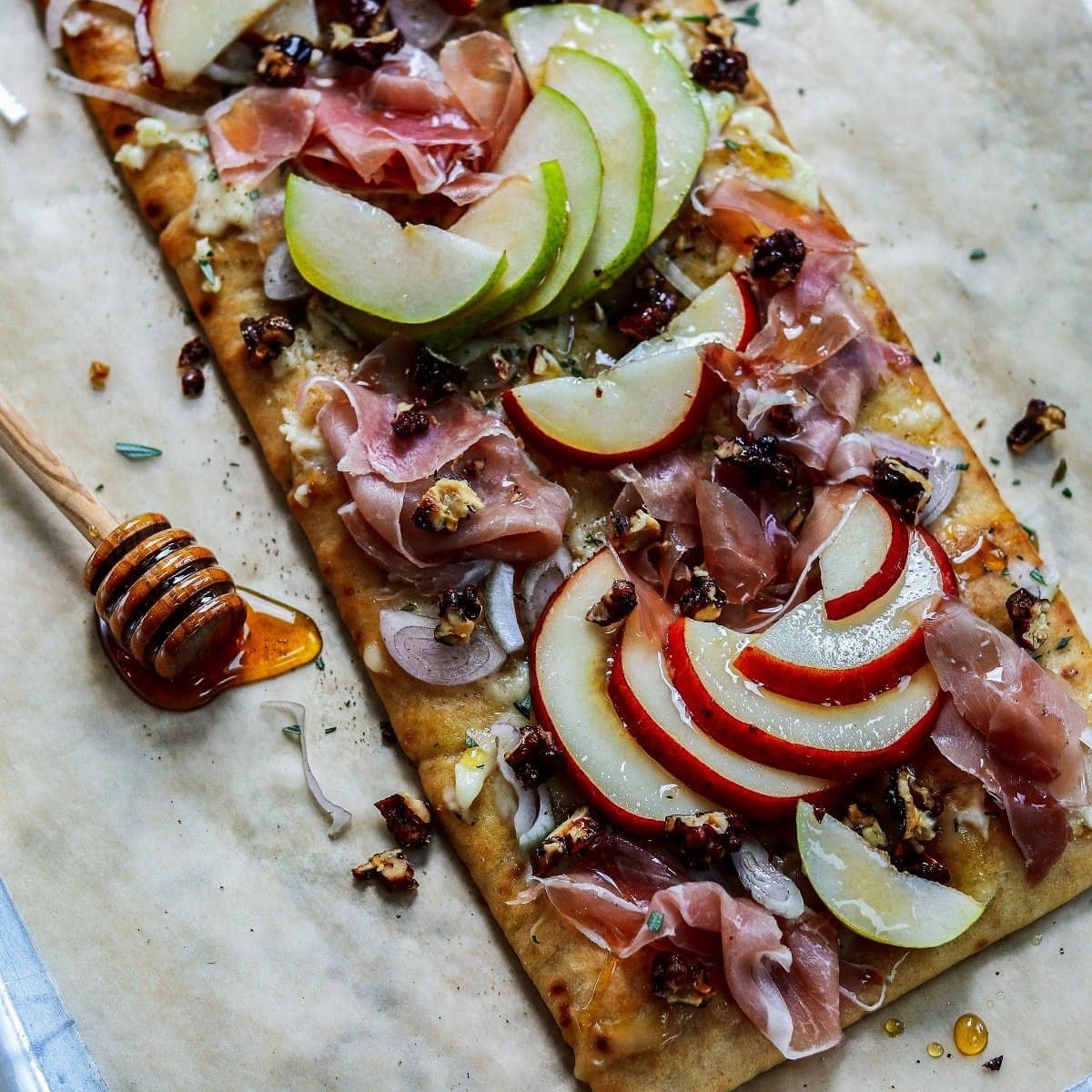 Flatbread with honey roasted pear and brie on top.