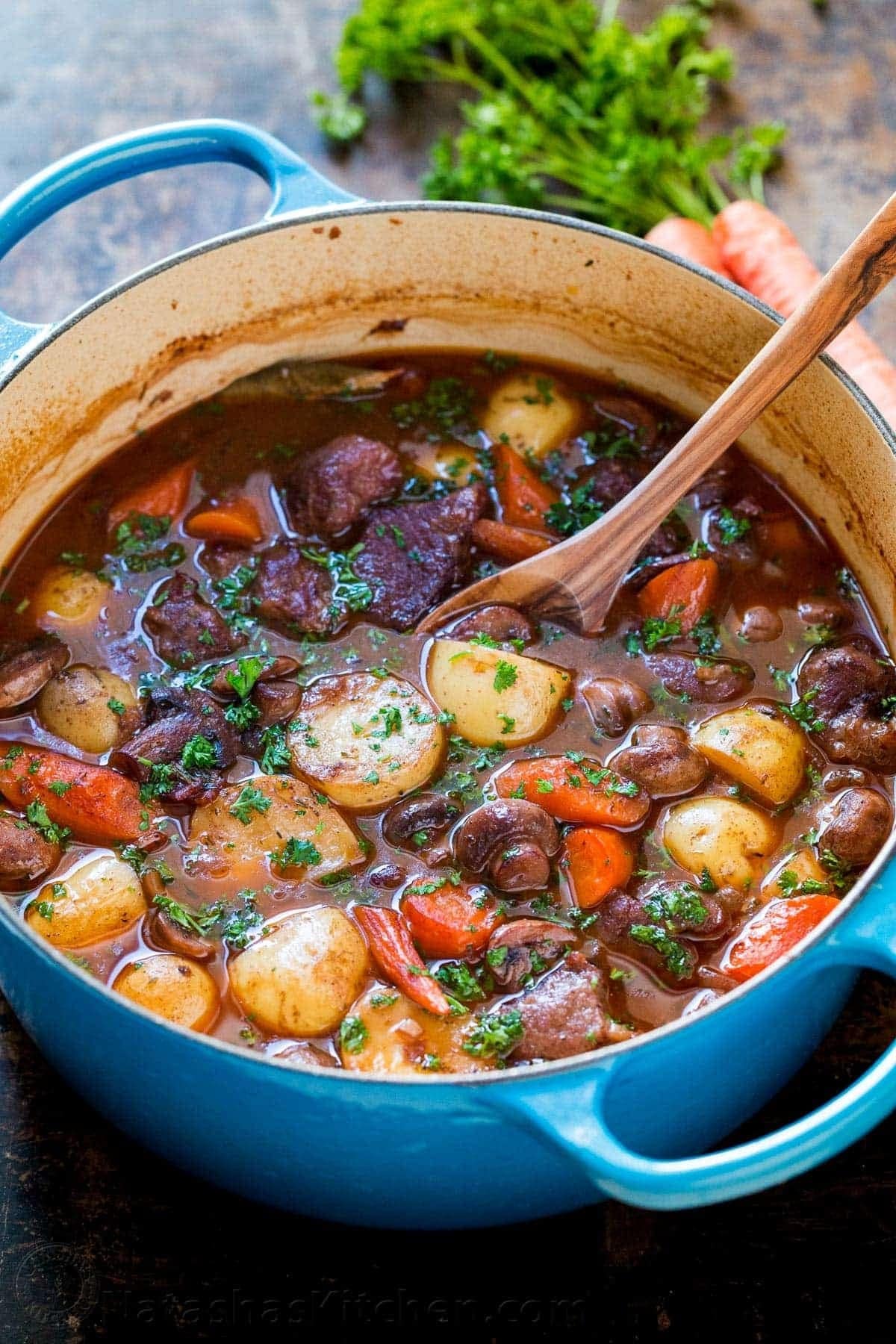 lamb-stew Lamb Stew cooked on a pot with carrots, potatoes and mushrooms