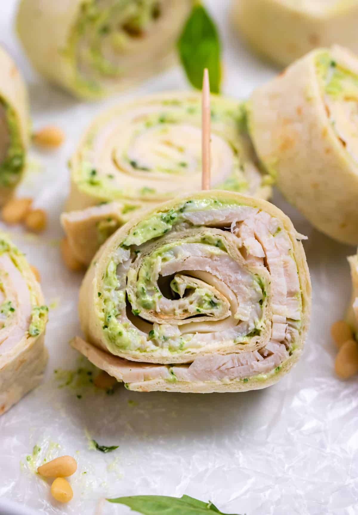 pesto-pinwheels Homemade Appetizing Pesto Turkey Pinwheels with Smoked Provolone