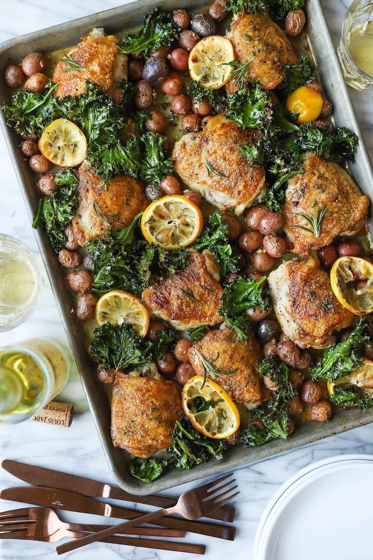 Chicken cooked with lemon, rosemary and baby potatoes in a sheet pan.