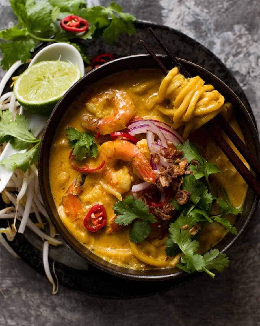 thai-coconut-soup Chopsticks scooping noodles on a bowl of Thai Coconut Soup