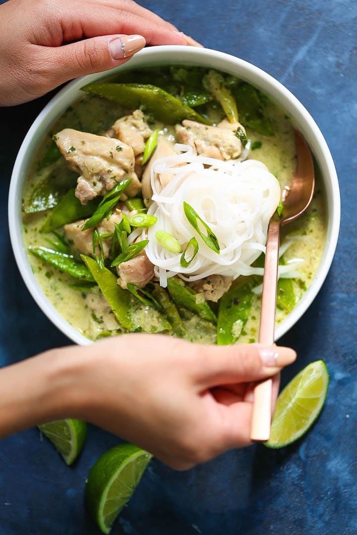 thai-green-curry-soup Bowl of homemade Thai Green Curry Soup with rice noodles, chicken breast, green curry paste, green onions, cilantro, ginger, snow peas and coconut milk