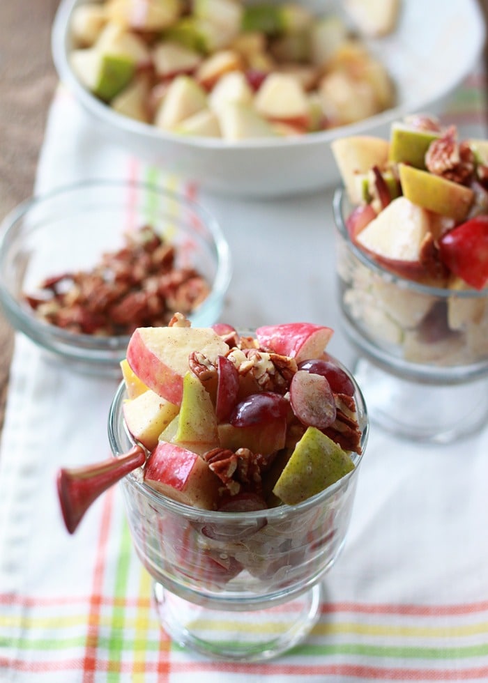 autumn-fruit-salad-with-cinnamon Autumn fruit salad with apples, pears, and grapes are drizzled with a creamy cinnamon dressing.