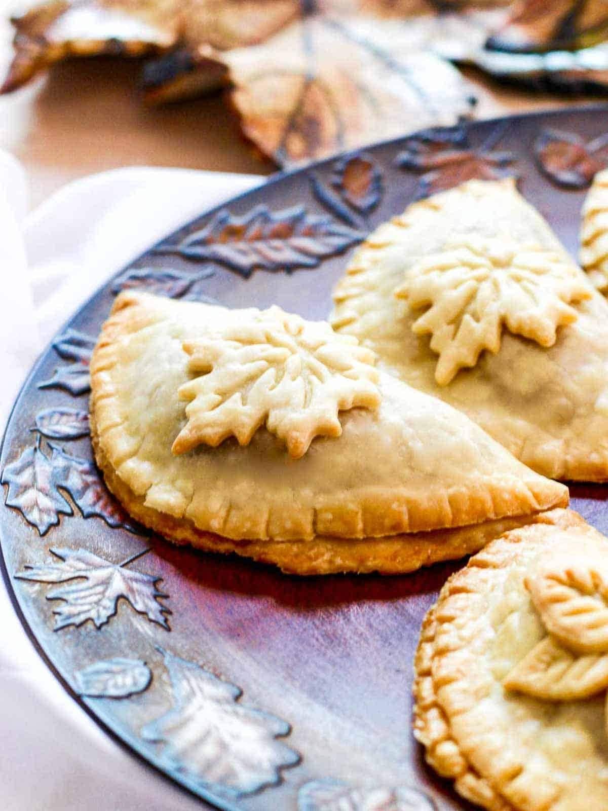 Baked empanadas on plate.