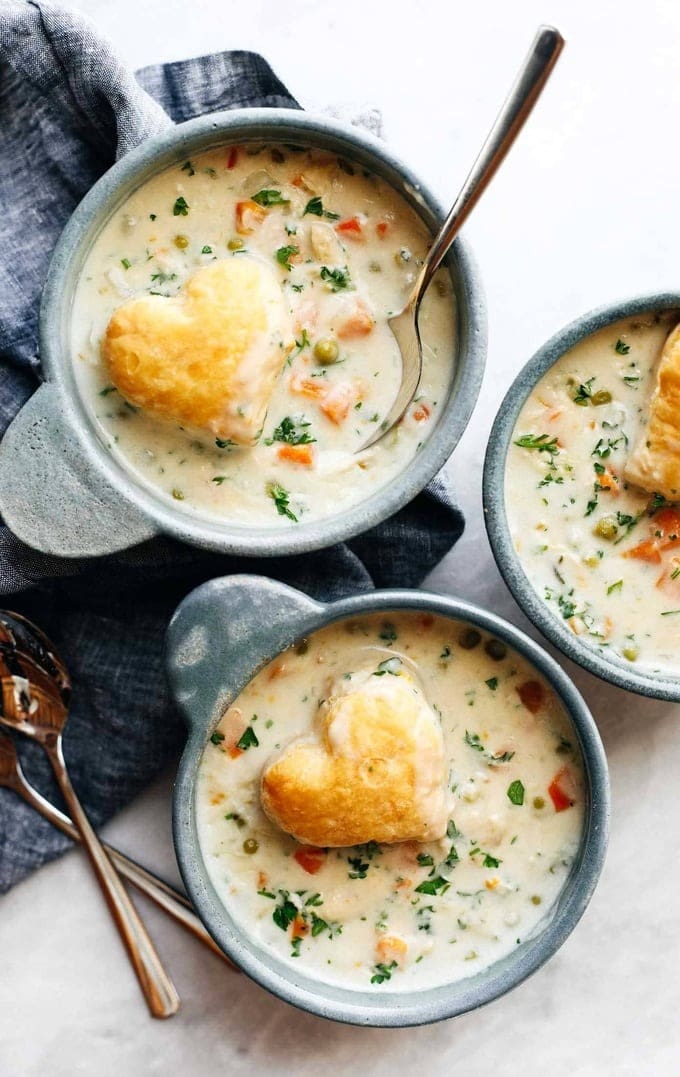 chicken-pot-pie-soup Top view of three bowls of chicken pot pie soup.