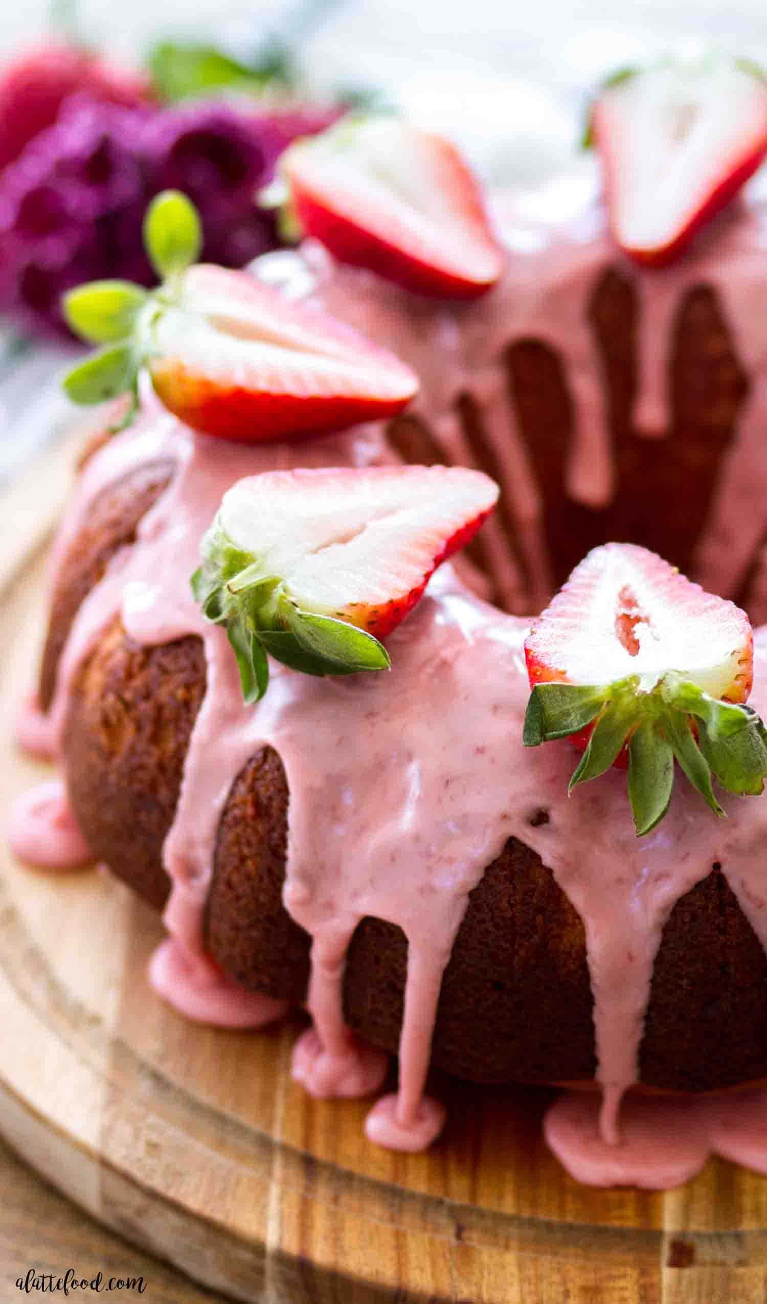 homemade-strawberry-bundt-cake Chocolate bundt cake topped with fresh strawberry and glaze.
