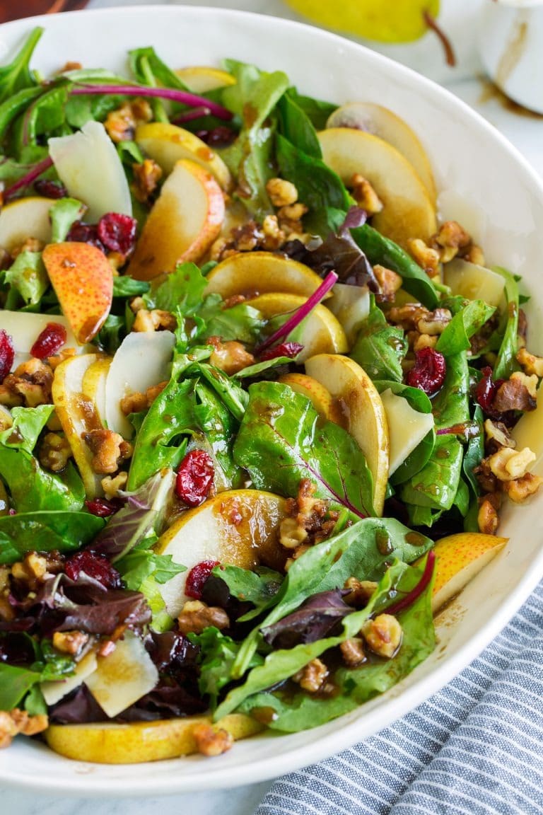 pear-salad Autumn pear salad with spring greens, sweet pears, candied walnuts, parmesan, and balsamic vinaigrette.