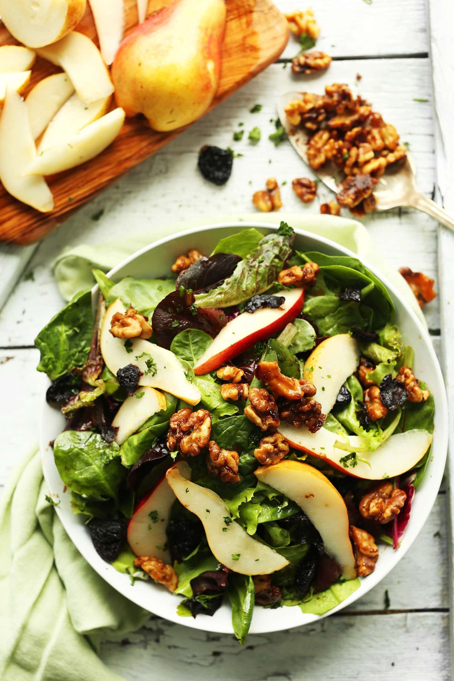 salad-with-pears-dried-cherries Bowl of pear balsamic salad with dried cherries and crunchy, candied walnuts.