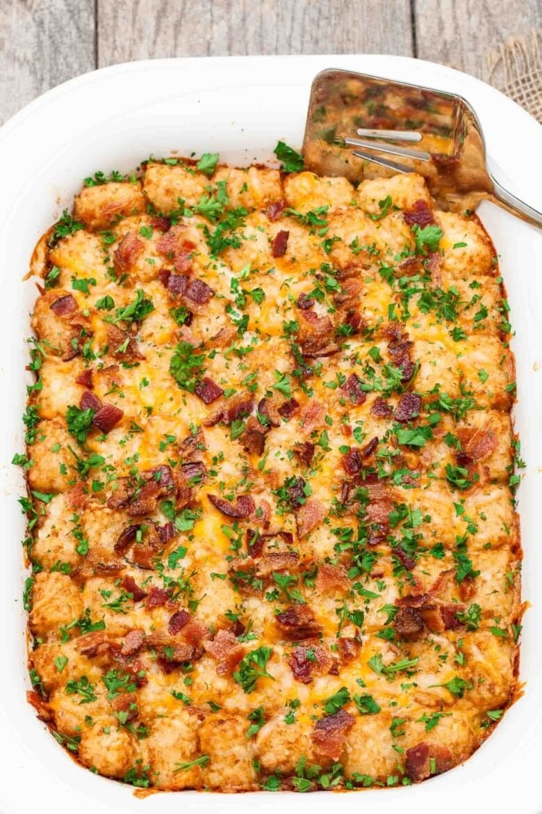 tater-tot-casserole Cheesy tater tot breakfast casserole in a white dish.