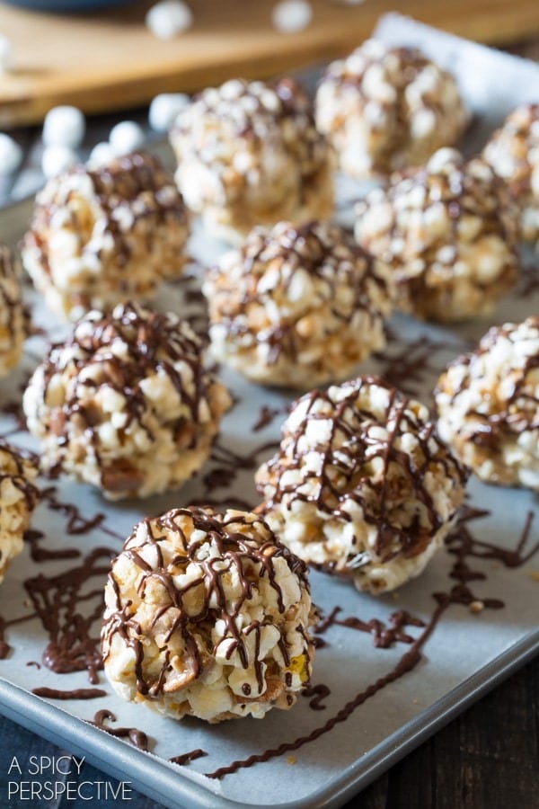 toffee-pecan-popcorn-balls Toffee Pecan Popcorn Balls on a tray with parchment paper