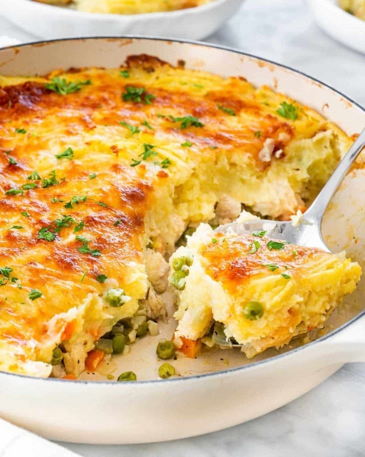 Turkey shepherd's pie with turkey meat filling, veggies and topped with mashed potatoes and golden cheese crust.